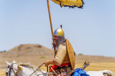 Lavi, Israel - July 05, 2024: Reenactment of the 1187 Battle of the Horns of Hattin (Ayyubid sultan Saladin defeated the crusaders): Knights on horses. Horns of Hattin, Israel clipart