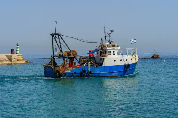 Stock image Jaffa, Israel - May 10, 2024: View of fishing boat exiting the historic port of Jaffa, now part of Tel-Aviv-Yafo, Israel