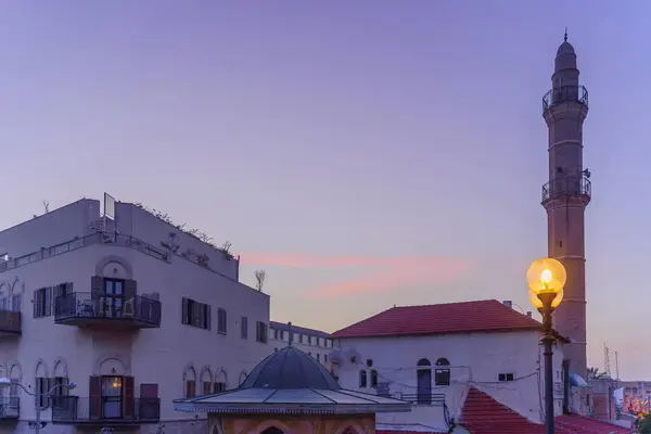 stock image Blue hour (before sunrise) view of the Mahmoudiya Mosque minaret, and nearby buildings, in the old city of Jaffa, now part of Tel-Aviv-Yafo, Israel