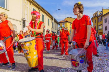 Cantu, Italy - February 25, 2023: Carnival parade, musician band, and crowd, in Cantu, Lombardy, Northern Italy clipart