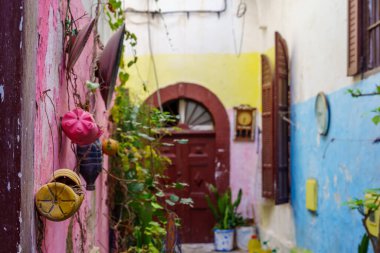 View of an alley with colorful walls and decorations, in the Old Medina, Casablanca, Morocco clipart