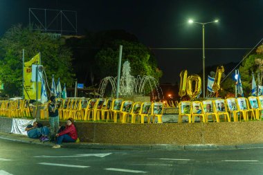 Haifa, Israel - November 16, 2024: People take shelter from a rocket attack, during a protest of support of the hostages, Haifa, Israel clipart