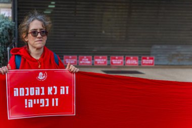 Haifa, Israel - December 11, 2024: Women activist group Bonot Alternativa protest near the Rabbinical Court, against the plan to extend these courts authorities. Haifa, Israel clipart