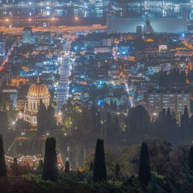 Evening view from above on downtown, with the Bahai shrine, Holiday of Holidays scene in the German Colony, Christmas tree, decorated churches, in Haifa, Israel clipart