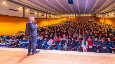 Haifa, Israel - January 26, 2025: Chairman Yair Golan speaks to the crowd, in an assembly of The Democrats party. Haifa, Israel clipart