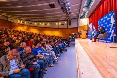 Haifa, Israel - January 26, 2025: Chairman Yair Golan and MK Naama Lazimi speak to the crowd, in an assembly of The Democrats party. Haifa, Israel clipart