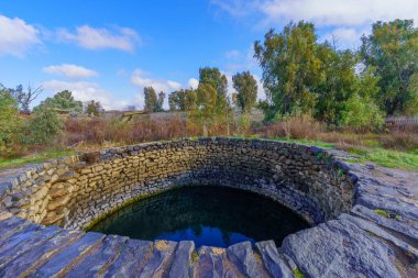 View of Ein Mokesh, Natural water pool in the Golan Heights, Northern Israel. The name means Mine Spring, because it is surrounded by mine fields. clipart