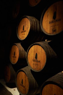 19-02-2015 Porto, Portugal - Wooden barrels filled with Porto wine in Sandeman's clipart