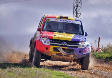 09-11-2014 Trijueque, Spain - A vehicle speeds through Trijueque during the 2014 Rally TT Guadalajara clipart