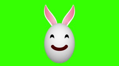 Yeşil ekranda gülümseyen tavşan yumurtası. Gülen suratlı şirin paskalya yumurtası.