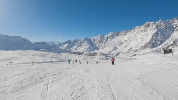 Skiers Skiing Slope Italian Alps Mountain View Follow Shot — Stock Video