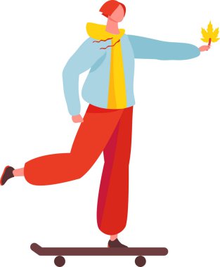 Genç kızıl saçlı kaykaycı, gündelik giysiler içinde, neşeyle kaykay sürerken canlı bir akçaağaç yaprağı tutarken güzel bir sonbahar gününde, renkli manzarayla dolu