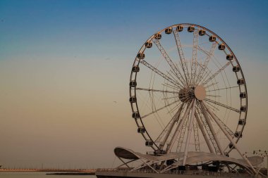 ferris wheel on the sunset sky