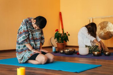 girls on a yoga class. Girls doing yoga and breathing practices 