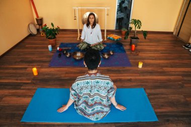 girls on a yoga class. Girls doing yoga and breathing practices 