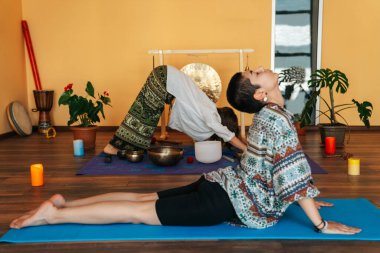 girls on a yoga class. Girls doing yoga and breathing practices 