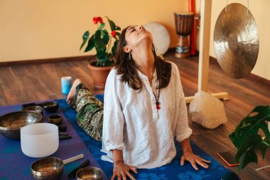 girls on a yoga class. Girls doing yoga and breathing practices 