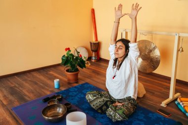 girls on a yoga class. Girls doing yoga and breathing practices 