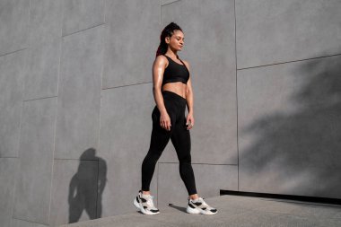 Fitness portrait, exercise and happy woman at gym for a workout, training and body motivation at health club. Face of sports or athlete female happy about performance, progress and healthy lifestyle