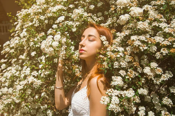 portrait of a red-haired girl with flowers, lifestyle, spring concept