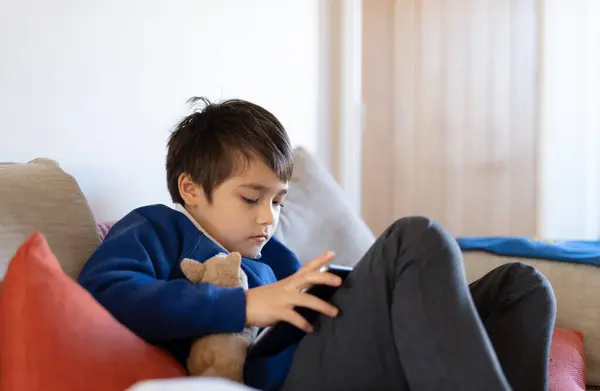 Preteen Schoolboy Doing Homework Digital Tablet Living Room Child Using — Stock Photo, Image