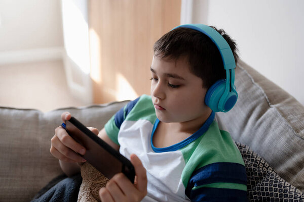 Addicted Child Headset Gaming Listening Music Thinking Young Boy Doing Stock Image