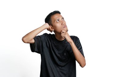 Asian man wearing black training t-shirt, Gesture thinking or getting idea. Isolated by white background