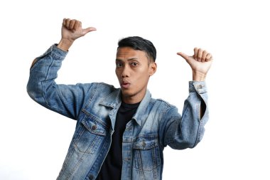 asian man wearing blue jean jacket showing thumbs up, isolated on white background