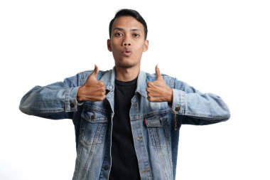 asian man wearing blue jean jacket showing thumbs up, isolated on white background