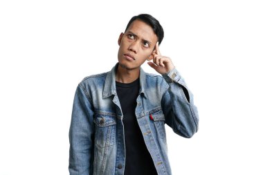 asian man wearing blue jean jacket showing expression thinking looking for idea, isolated on white background