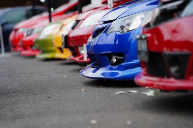 Side view of a Japanese sports car, showing the car's bumper.