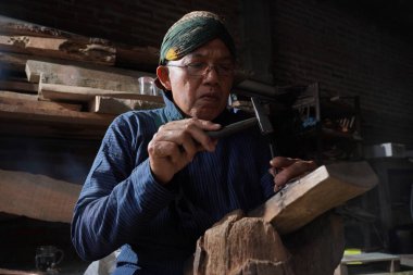 Keris craftsmen in the workshop, in the process of making keris. : Bantul, Indonesia - 25 August 2022