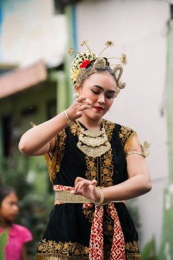 women display graceful Javanese dance movements. : Yogyakarta, Indonesia - 05 January 2023