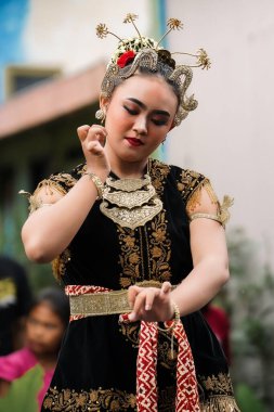 women display graceful Javanese dance movements. : Yogyakarta, Indonesia - 05 January 2023