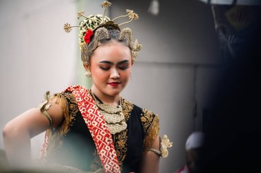 women display graceful Javanese dance movements. : Yogyakarta, Indonesia - 05 January 2023