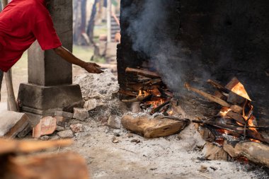 The process of burning pottery crafts to make them stronger and more durable