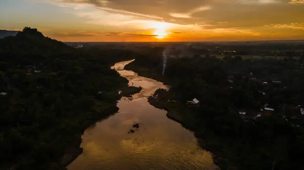 Beautiful natural view of river silhouette at sunset, aerial view