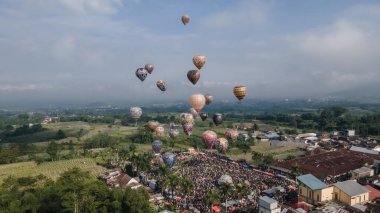 Wonosobo, Indonesia - April 14, 2024: The excitement of the hot air balloon festival in Wonosobo, Central Java. The event is held every Eid al-Fitr holiday. clipart