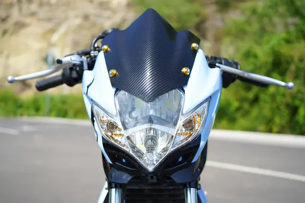 stock image closeup, 4-Stroke underbone motorcycle headlight