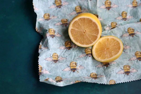 Lemon on beeswax food wrap. Reusable sustainable wrap. Environment friendly alternative of food packaging.