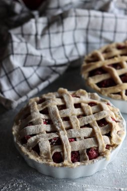 Lattice sweet cherry pie close up photo. Homemade tart with no sugar added. Healthy eating concept. 