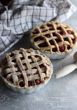 Lattice sweet cherry pie close up photo. Homemade tart with no sugar added. Healthy eating concept. 