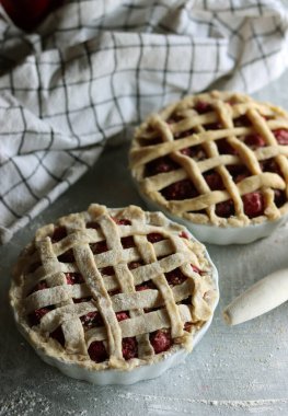 Lattice sweet cherry pie close up photo. Homemade tart with no sugar added. Healthy eating concept. 