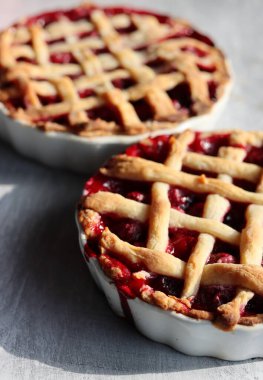 Lattice sweet cherry pie close up photo. Homemade tart with no sugar added. Healthy eating concept. 