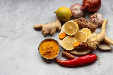 Detox cocktail ingredients on a table. Top view photo of lemon, ginger and turmeric. Alternative medicine concept.  clipart