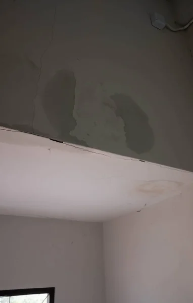the wall is damp water stains from moisture on the wall