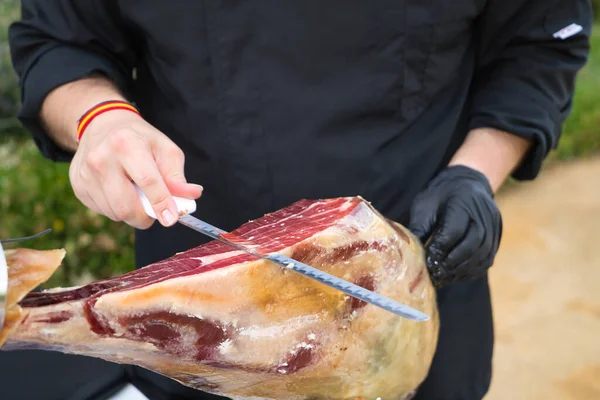 stock image Detail of an Iberian ham cut by a professional. Concept pork, food, ham, iberian, spain, denomination of origin.