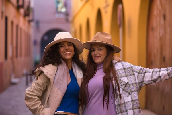 Two Women Young Beautiful Wearing Hats Coats Posing Looking Camera — Zdjęcie stockowe