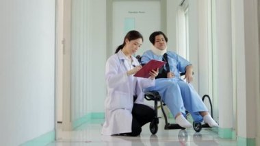 Female doctor taking notes on treatment of obese female patients Stiff neck with soft splint to support the neck. Concept of medical services in hospitals.