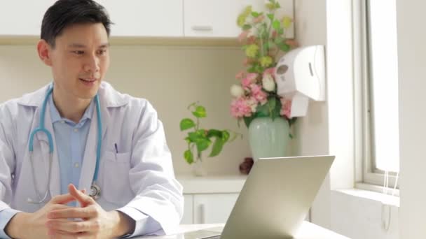Asian Male Doctor Sitting Office Wear Medical Uniform Prepare Treat — Vídeo de stock